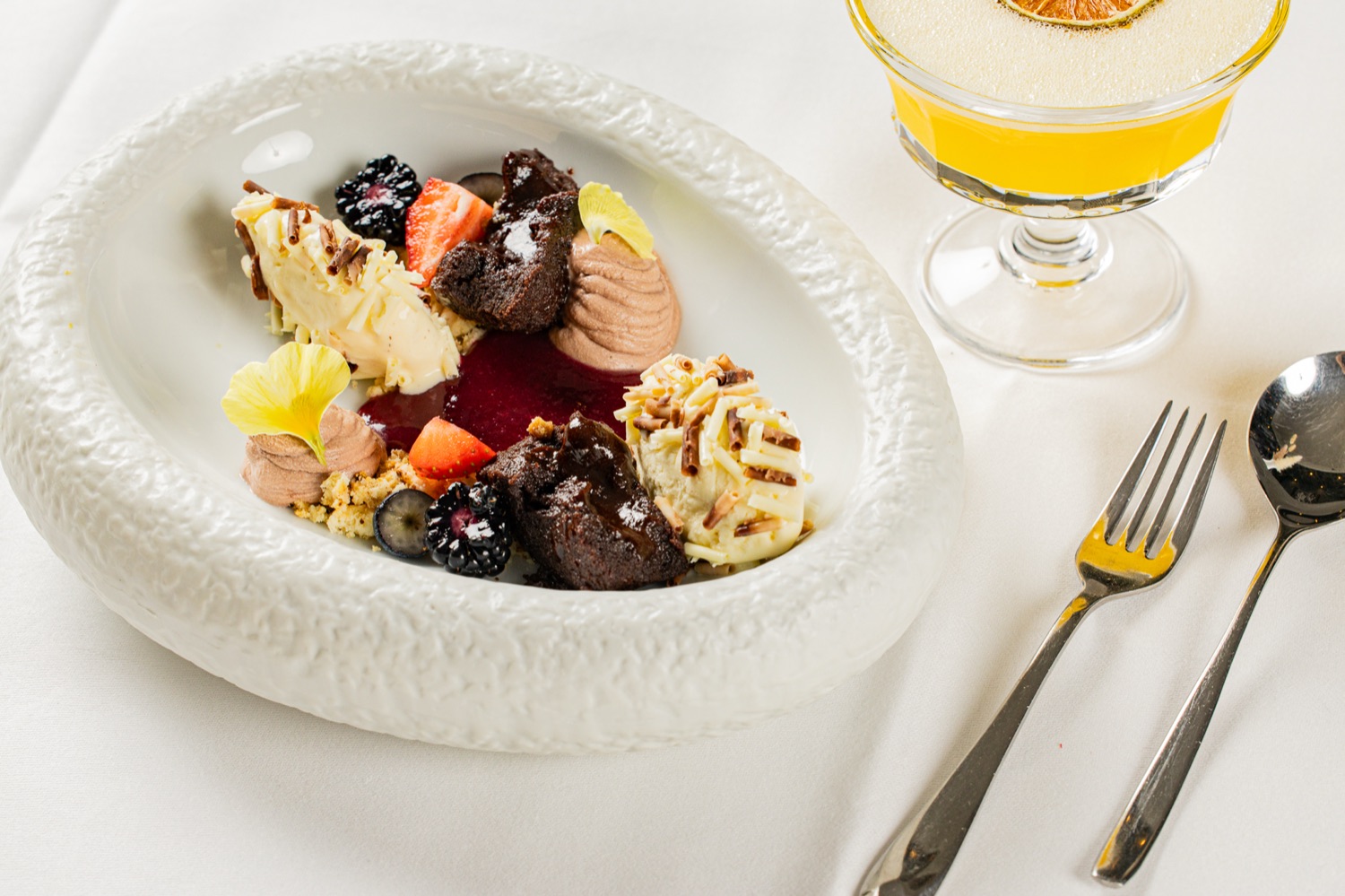 Chocolate dessert with ice cream and berries at Casa Bellucci Berlin